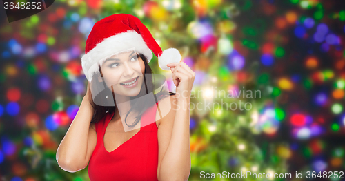 Image of beautiful sexy woman in santa hat and red dress