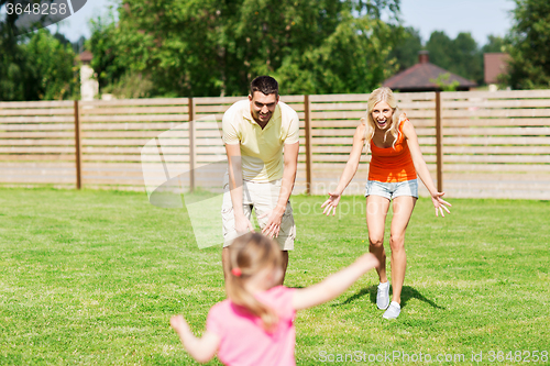 Image of happy family playing outdoors