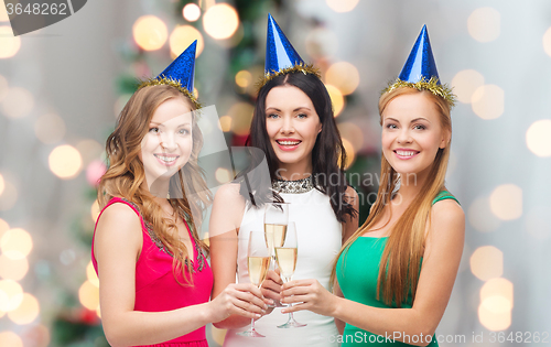 Image of smiling women holding glasses of sparkling wine