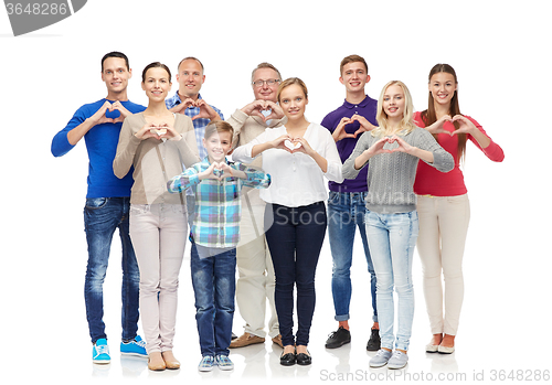 Image of group of smiling people showing heart hand sign