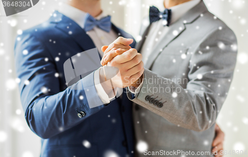 Image of close up of happy male gay couple dancing