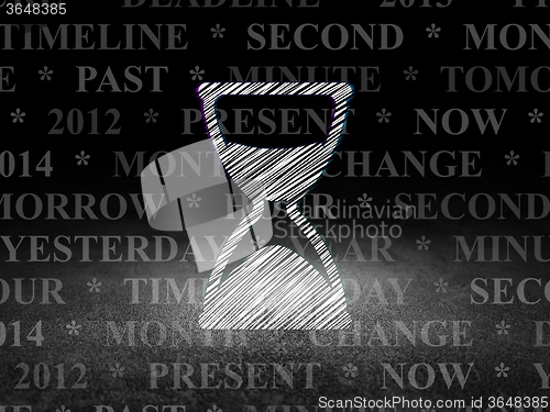 Image of Time concept: Hourglass in grunge dark room