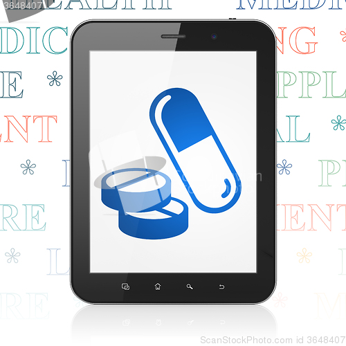 Image of Healthcare concept: Tablet Computer with Pills on display