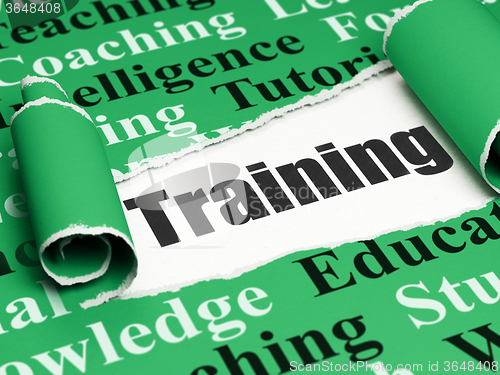 Image of Education concept: black text Training under the piece of  torn paper