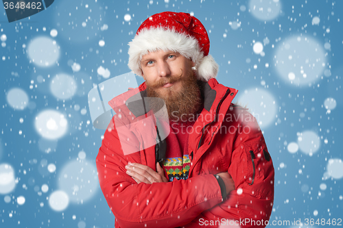 Image of bright picture of handsome man in christmas hat.