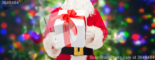 Image of man in costume of santa claus with gift box