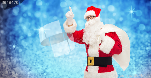 Image of man in costume of santa claus with bag