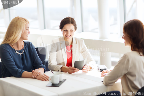 Image of happy women looking at restaurant bill