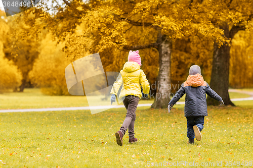 Image of group of happy little kids running outdoors