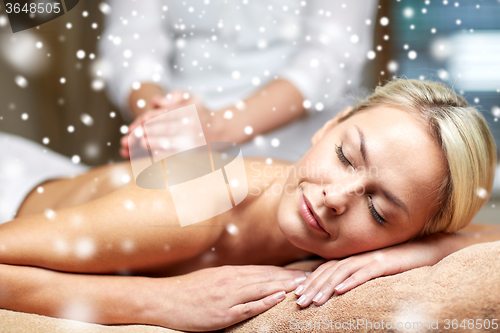 Image of close up of woman having back massage in spa