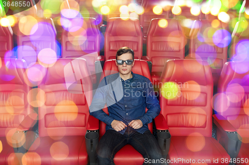 Image of young man watching movie in 3d theater