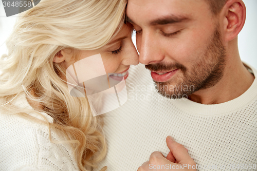 Image of close up of happy couple faces with closed eyes