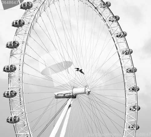 Image of london eye in the spring sky and white clouds