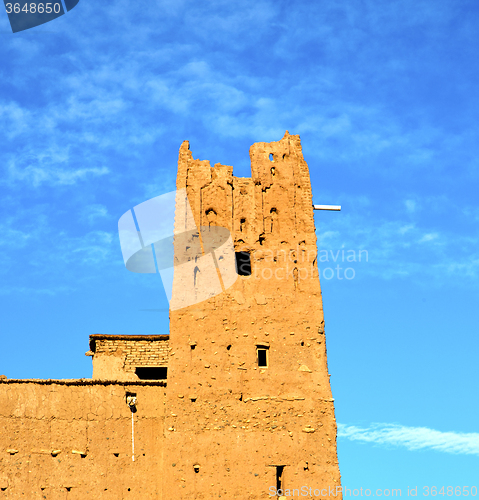 Image of africa  in histoycal maroc  old construction  and the blue cloud