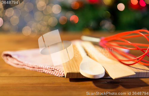 Image of close up of kitchenware set on wooden table