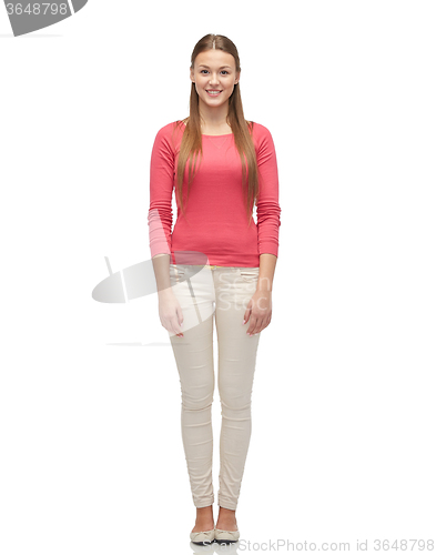 Image of smiling young woman in pink pullover and jeans