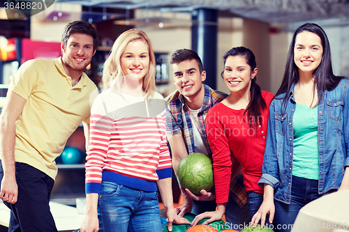 Image of happy friends in bowling club