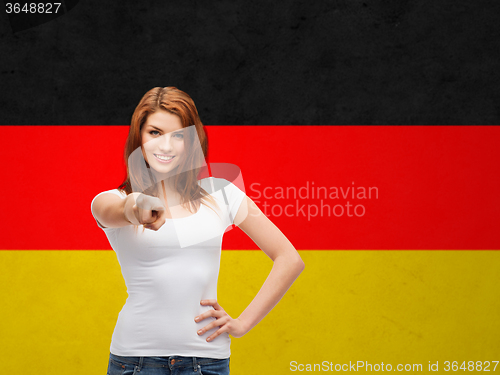 Image of woman in t-shirt pointing at you over german flag