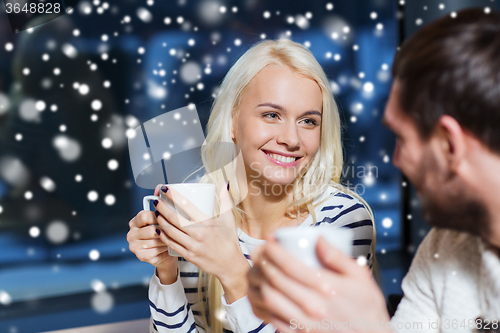 Image of happy couple meeting and drinking tea or coffee