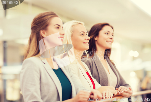 Image of happy young women in mall or business center