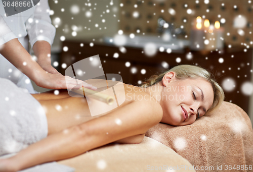 Image of close up of woman lying and having massage in spa