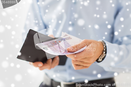 Image of close up of businessman hands holding money