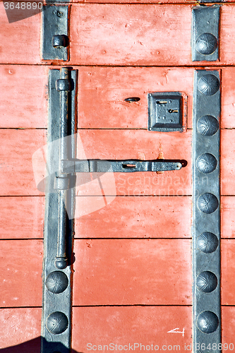 Image of brown  morocco in africa the old red  rusty safe padlock 