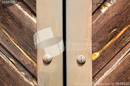 Image of stripped paint  door    in italy   ancian wood and traditional  