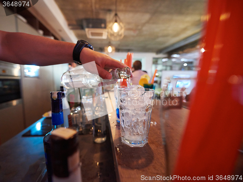 Image of barman prepare fresh coctail drink