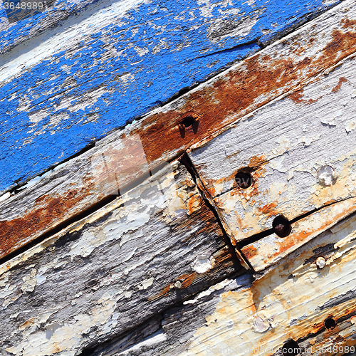 Image of Old boat with peeling paint background texture