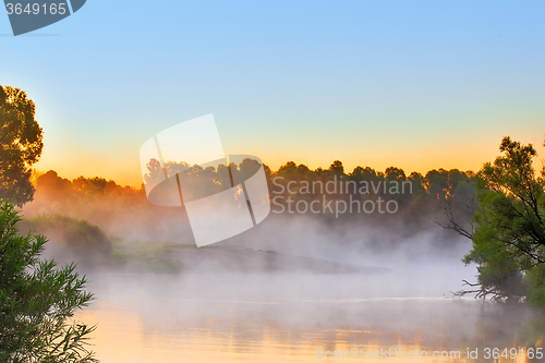 Image of Early foggy morning and a small river.