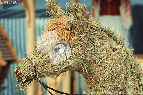 Image of Figurine made of straw in the form of a horse.