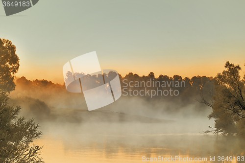 Image of Early foggy morning and a small river.