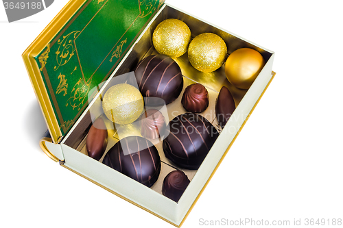 Image of Chocolate sweets in the box on the white background.