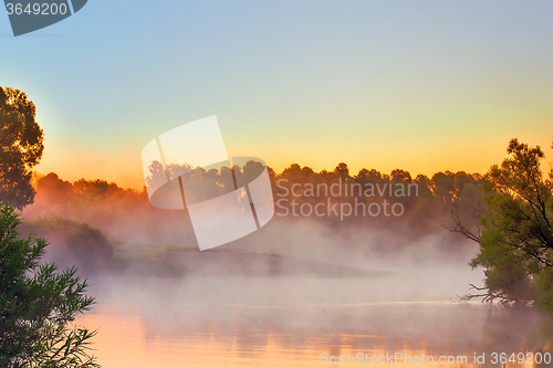 Image of Early foggy morning and a small river.