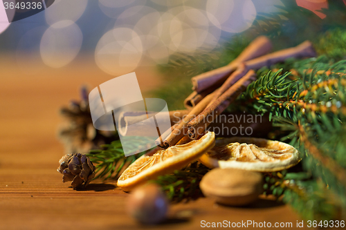 Image of christmas fir branch, cinnamon and dried orange