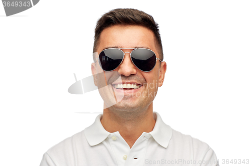 Image of face of smiling man in polo t-shirt and sunglasses