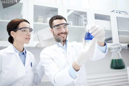 Image of young scientists making test or research in lab