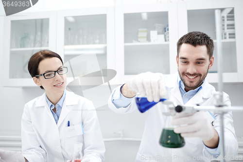 Image of young scientists making test or research in lab