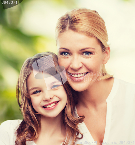 Image of smiling mother and little girl