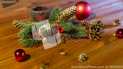 Image of christmas fir branch decoration and candle lantern
