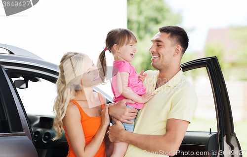 Image of happy family with child laughing at car parking