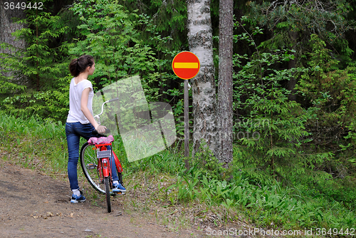 Image of Girl and traffic sign.