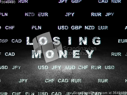 Image of Currency concept: Losing Money in grunge dark room