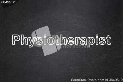Image of Healthcare concept: Physiotherapist on chalkboard background