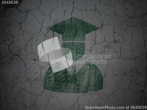 Image of Education concept: Student on grunge wall background