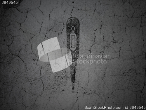 Image of Medicine concept: Thermometer on grunge wall background
