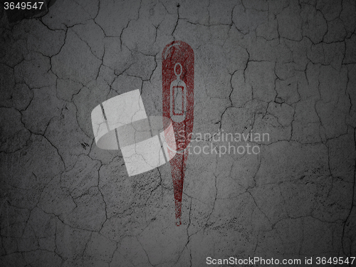 Image of Healthcare concept: Thermometer on grunge wall background