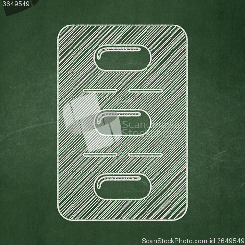 Image of Healthcare concept: Pills Blister on chalkboard background