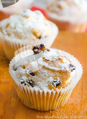 Image of Sweet Muffins with tea on the table